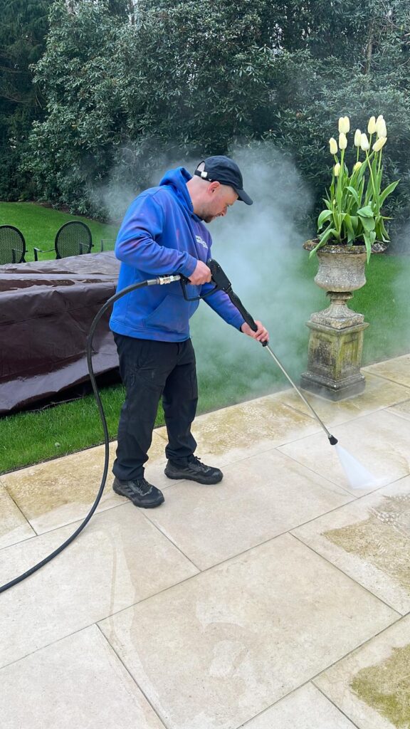 Pristine team steam cleaning a patio